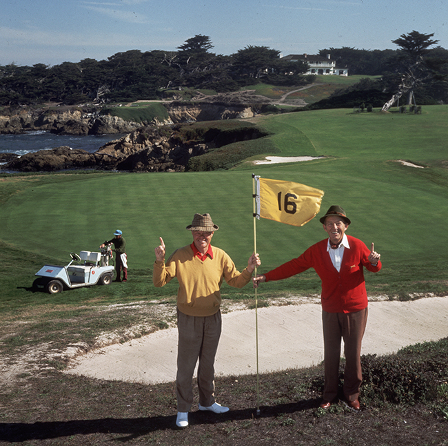 1977: At the 16th hole on Pebble Beach golf course, singer and film star Bing Crosby (in red) and A Thomas Taylor. (Photo by Slim Aarons/Getty Images)